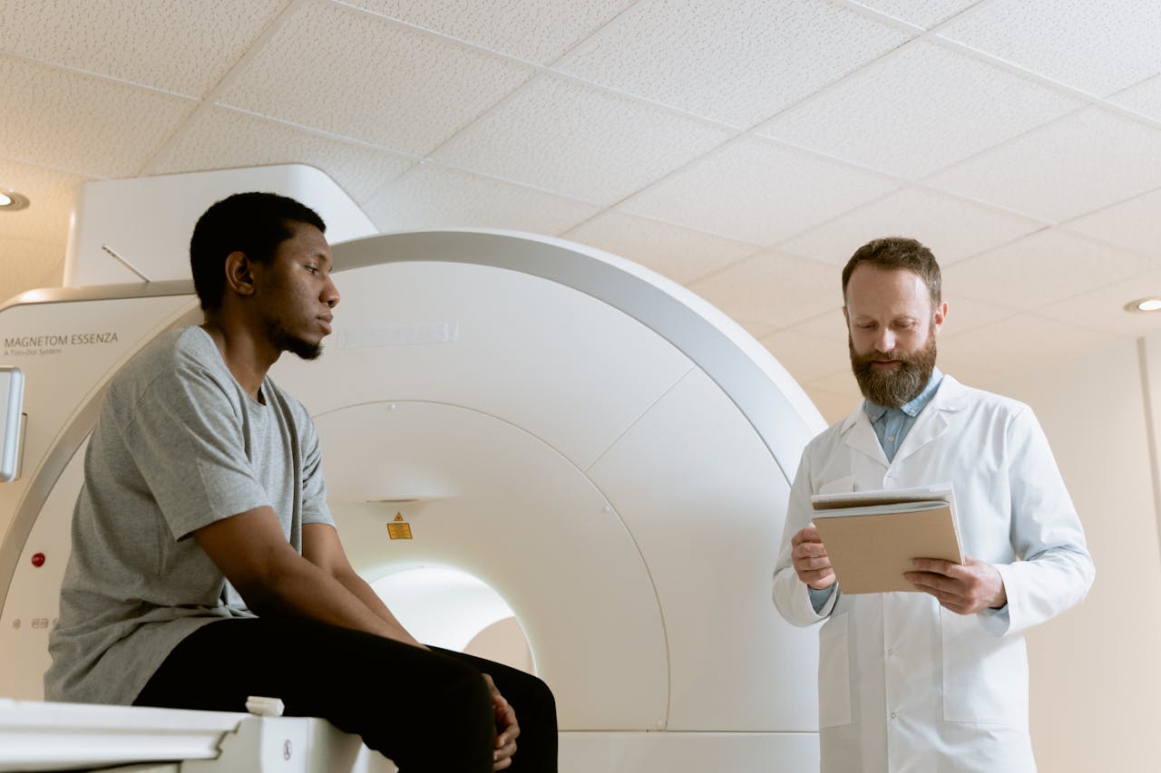 Doctor reviews patient's MRI results in a hospital setting.